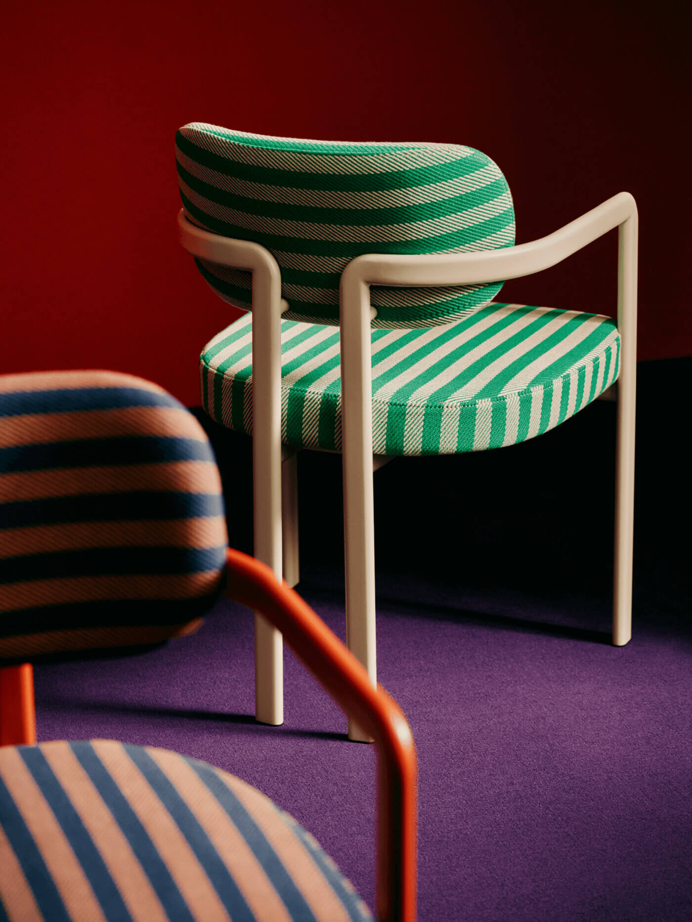 Green striped chair on colorful backdrop